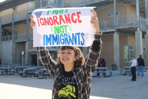 Sophomore, Skylar Johnson, carries a sign that says, Fight ignorance, not immigrants.