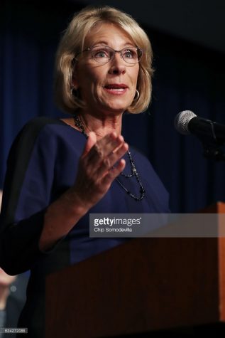 Betsy Devos answers questions during senate confirmation hearing.
