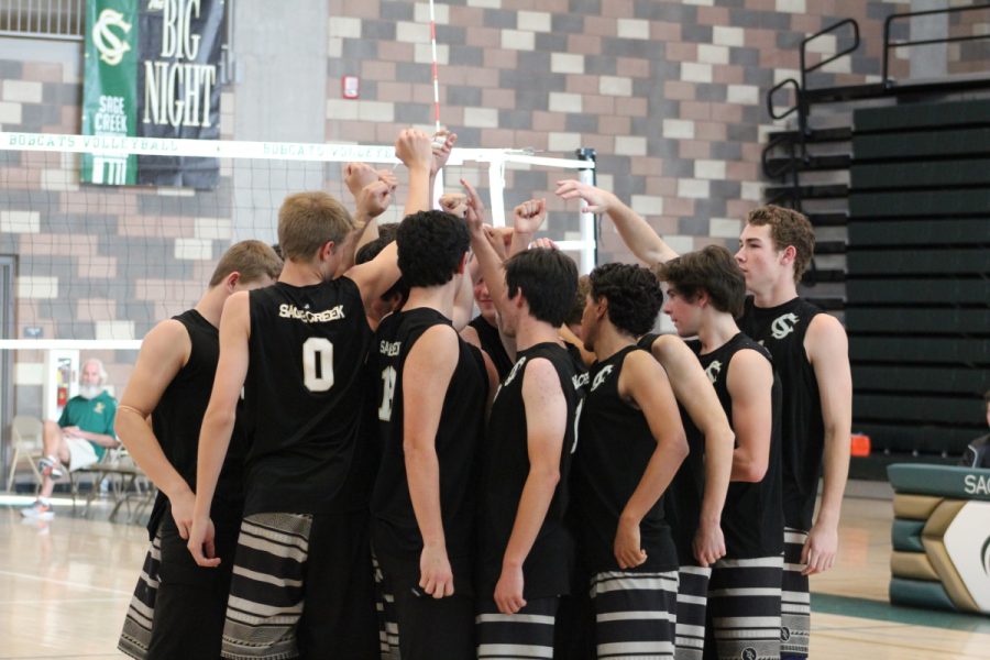 Sage Creek Bobcats huddle for a pump up from senior Will May (middle of group) before the match. 