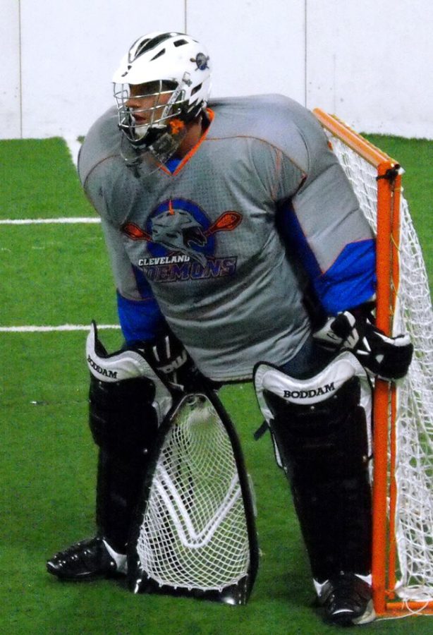 Box lacrosse goalie defending the teams net.