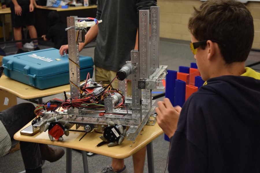 Robotics team member constructs for a future competition.