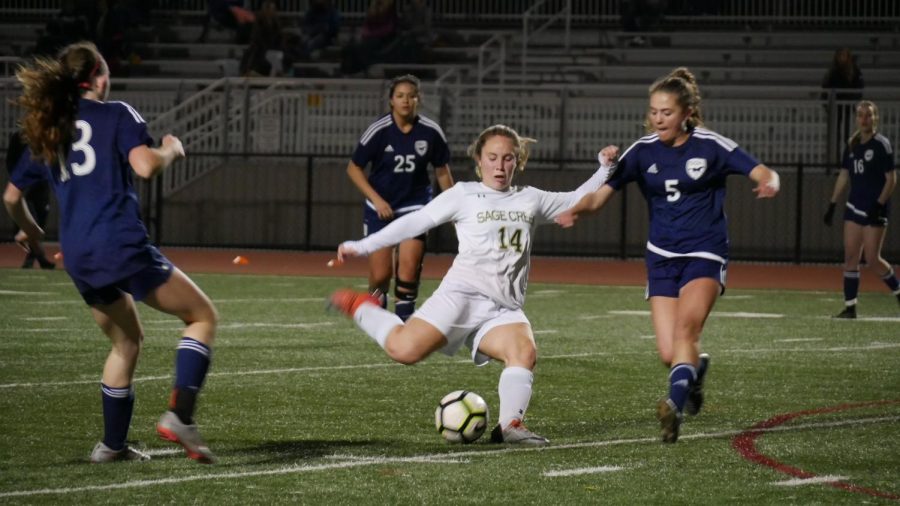 Silje Vigeland passes the ball down the field to the rest of the team trying to secure a point for Sage Creek.