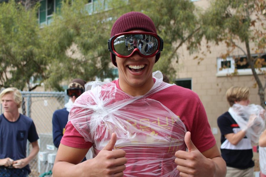 ASB president, Duncan Kelly, is seen giving his fellow classmates two thumbs up before diving into the soapy mess.
