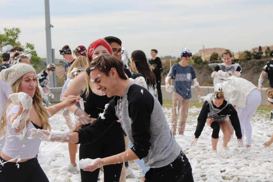 Juniors Andy Babcock, Maddie DeVilbiss, and Halley Light are pictured laughing and throwing the soapy snow, something most Californians do not often get to experience.