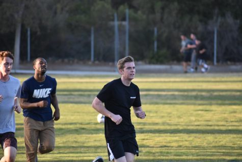 Senior Grant Hughes finishes running a lap around the field. Recruits like Grant complete rigorous training to be eligible to serve.