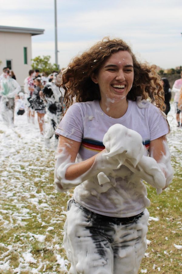 Senior Cameron Grogan is pictured sprinting through the soapy snow towards her friends.