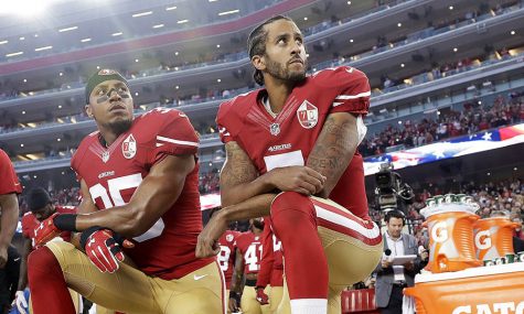 Former 49ers quarterback Colin Kaepernick kneels during the national anthem before a game. This action has sparked heavy controversy, prompting the changes made to the NFL’s employee’s agreement.