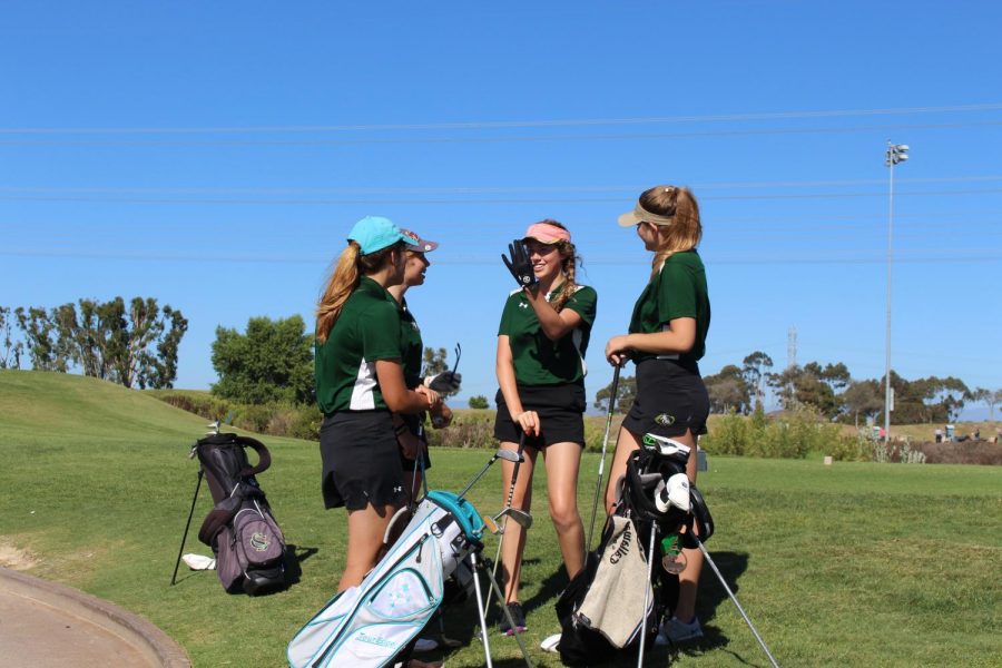 Girls Golf teammates huddling around before competing against Vista High School on Tuesday, Sept. 18th. 