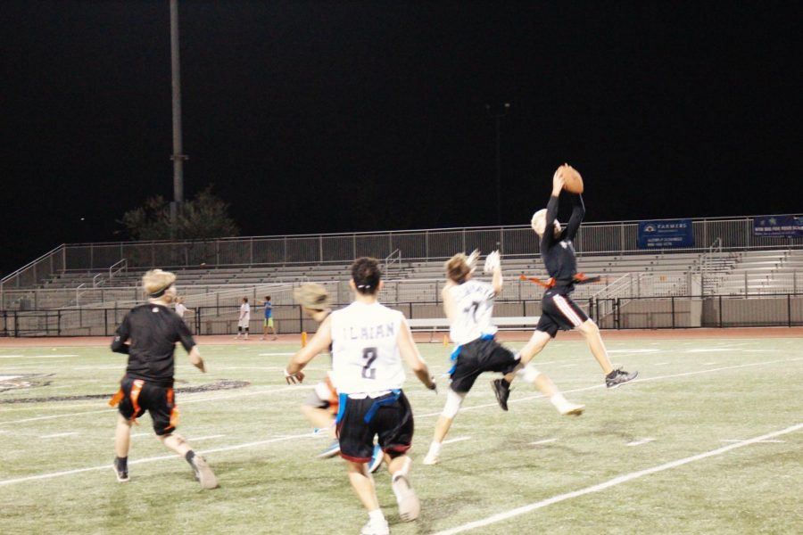 Senior Oliver Schnitzenbaumer catches a ball thrown by the quarterback. His team, “The Wamen Respectors,” advanced to the final game against the teachers. 