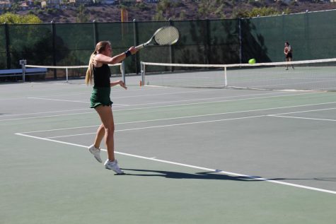 Senior Lindsey Williams takes a quick swing with her racket during the match against RBV.