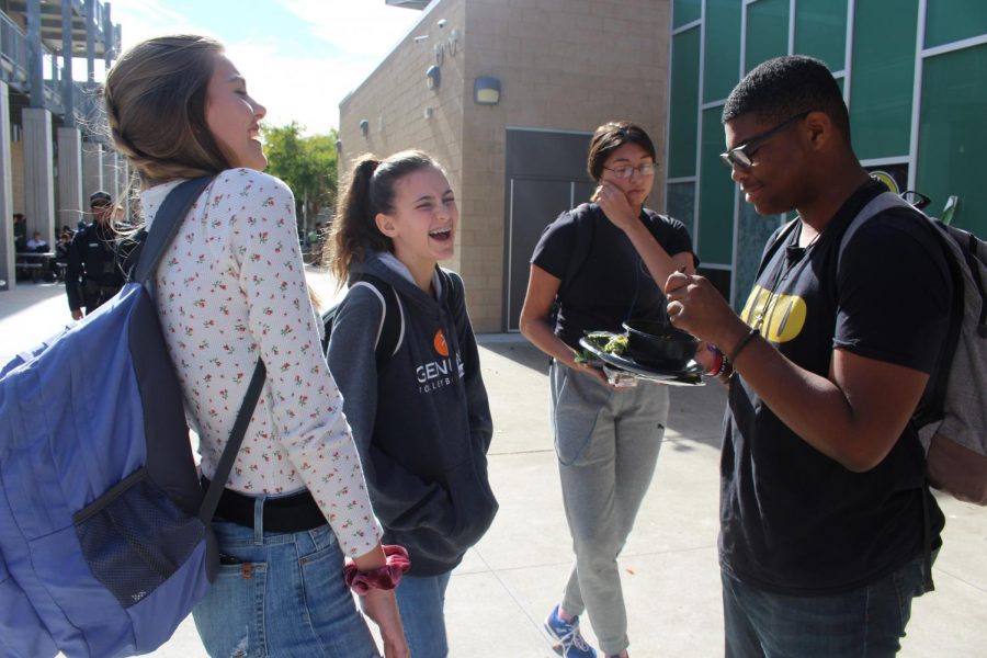 An eighth grade Shadow Cat laughs with her Shadow Cat ambassador and her friend during lunch. All Shadow Cats on Dec. 4 came from Calavera Hills Middle School.