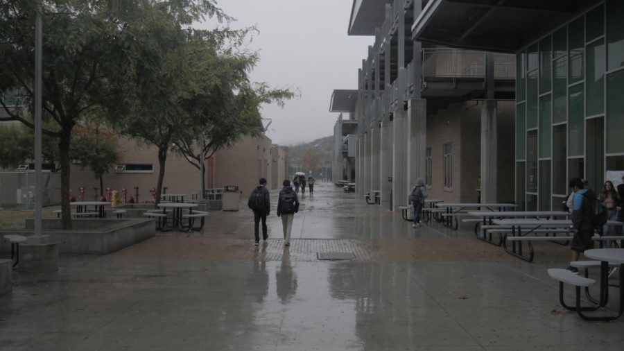 Students trudge through the soaked academic mall, attempting to make it to their next class relatively dry. Last week, Carlsbad was greeted with plentiful amounts of rain, causing students to seek refuge under awnings, classrooms and in the library.