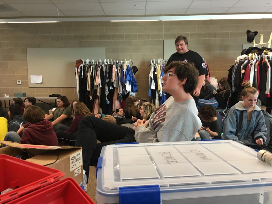 Theater Students take a break before singing their parts in this years school play, Les Miserables. That day was a vocal rehearsal in which all students were placed in the old 5000 building theater class. The cast has been rehearsing almost every day for the past few months.