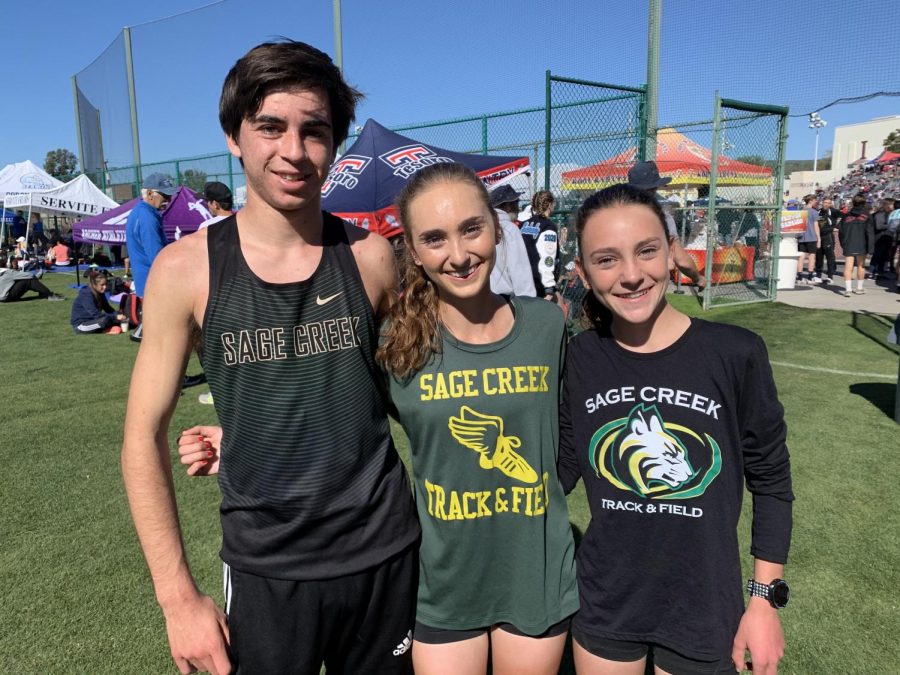 SCHS Track and Field long distance runners pose for a photo after racing the 2 mile at the Trophy Invitational on Saturday. Junior Skyler Wallace won her race with a 10:45 two mile with her sister, Stormy Wallace, right behind her with an 11:17. Senior Justin Morris also beat his personal record with a two mile time of 9:31.
