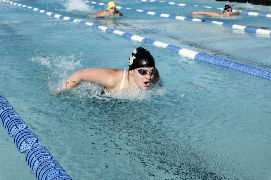Junior Judy Deatherage competes against El Camino High School in the 100 Meter Fly. Deatherage won the race, finishing in first place.