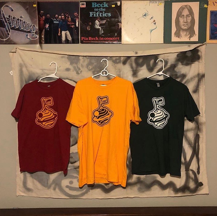 Shirts from Rink’s clothing brand, Flopp, can be seen hanging on display in his room. Flopp has been in motion for around two years now.