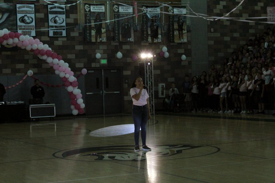 Priya Richards sings the “Star-Spangled Banner” for the students of Sage Creek before the pep rally on Oct. 4. The pep rally encouraged school spirit before Sage Creek’s annual Staff vs. Students Flag Football tournament.