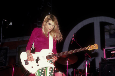 Kim Gordon plays bass during a live show. Gordon was a contributing member to the band Sonic Youth throughout their years and gave rise to inspiring female voices to join the rock genre.