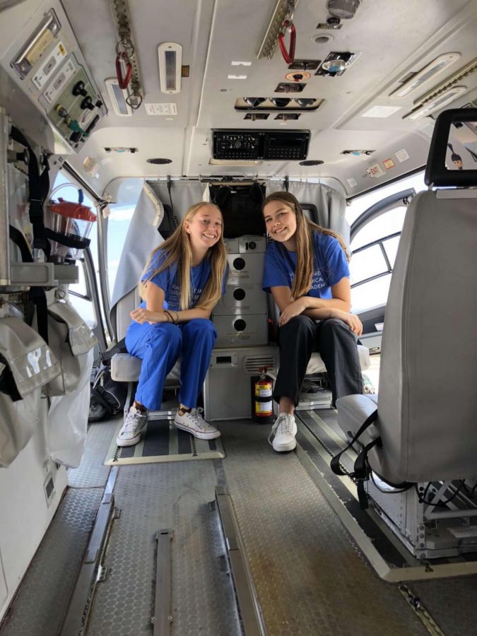 Grace O’Grady and her friend are sitting in the backseat of an ambulance. They both were a part of the summer program and Rady’s.