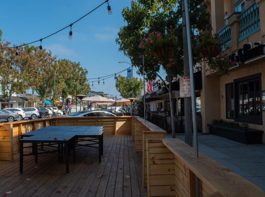 A Carlsbad restaurant creates a temporary patio in their parking lot, allowing extra suitable seating due to the coronavirus pandemic. Many businesses have been given the green light by local governments to temporarily expand into streets in order to replace their lost indoor space.  