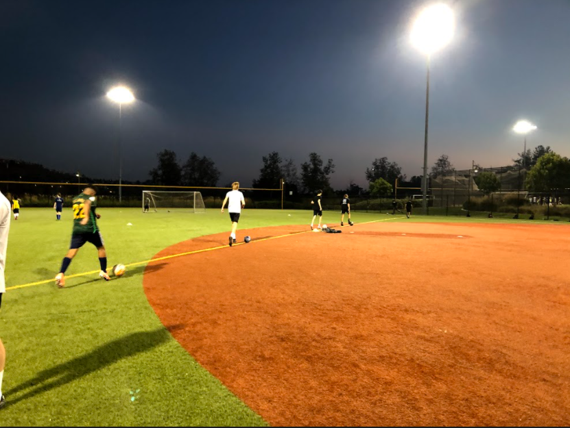 Players spread out six feet apart during drills in order to try to create a safe environment. Although practices haven’t been the same since the pandemic, coaches still expect their players to practice hard.