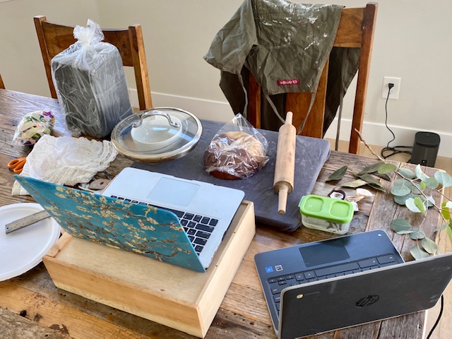 Art teacher Cathryn Burroughs shows her crowded home setup that is used for class Google Meets. With many students and activities planned for them, some educators must balance their workload while overseeing their students from home.