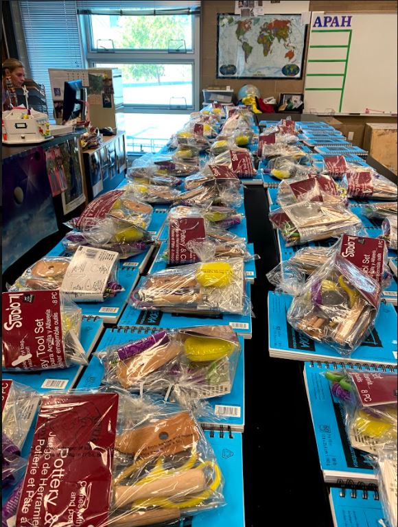 Art teachers Cathryn Burroughs and  Magan Herrick complete setting up bags of necessary supplies for their pottery students at the beginning of the school year. Due to a widespread lack of home materials, teachers may send the essentials home to students. 