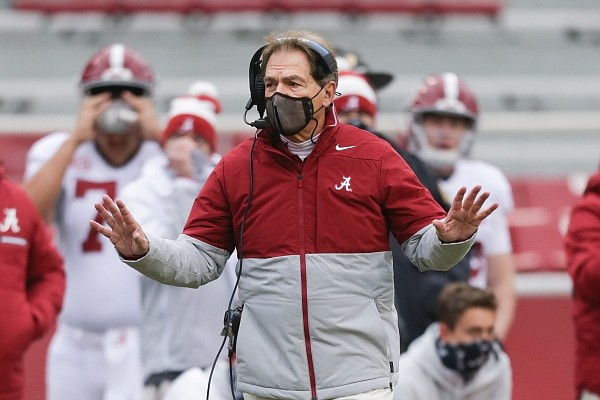 Alabama head coach Nick Saban strolls the sideline during the Crimson Tide’s 52-3 blowout of Arkansas. Alabama has embarrassed most of the teams on their schedule this year however, Alabama will face better competition in the CFP. 