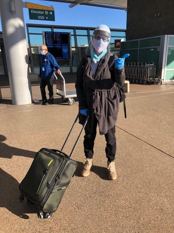 A Carlsbad nurse prepares to fly to Texas. In the era of COVID-19, many who choose to fly out of state take extra safety precautions.