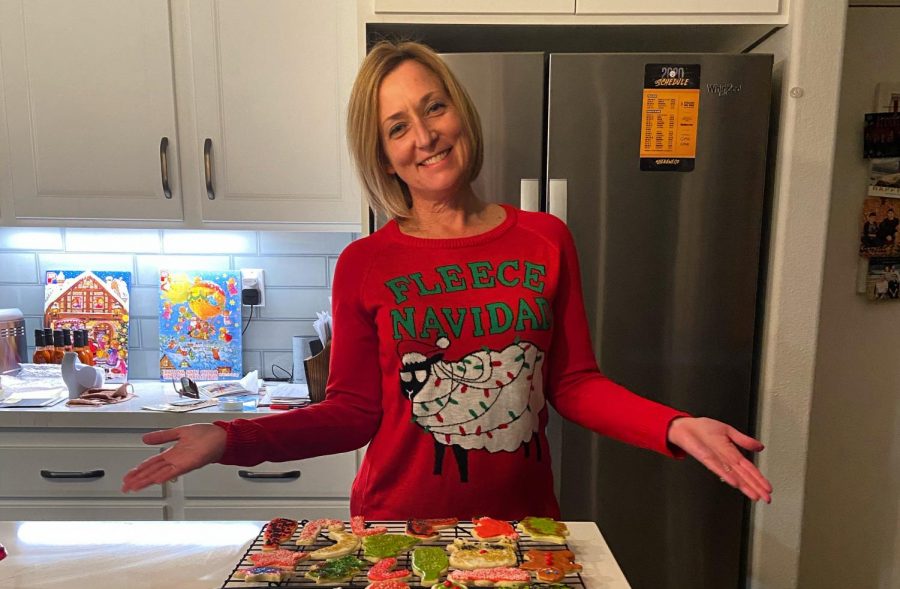 Jill Roth stands with a freshly completed batch of sugar cookies. Her fun-loving character shines through everything she does.