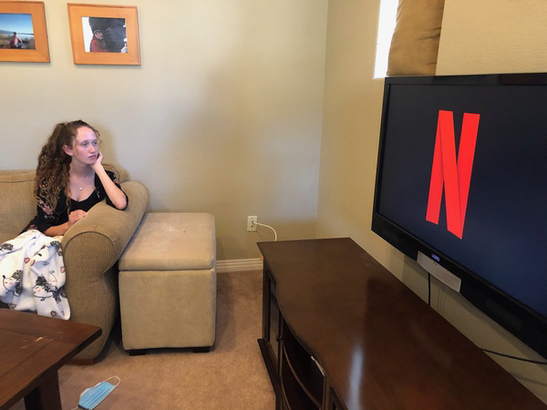 A student watches Netflix in their free time at home. It is a common pastime for many to return from a long day of work and unwind watching a show or movie. (photo by Evan Humphrey) 
