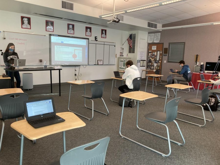 English teacher Mrs. Mandal teaches her students hybrid learning and in person. Sage Creek High School enforces many safety protocols such as social distancing between students and the wearing of masks. 