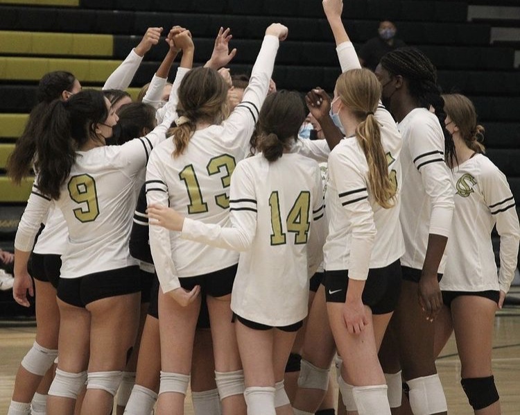 The girls volleyball team celebrates a 3-0 win at their home game against Escondido High School. They have won all but one of their home games so far this season.