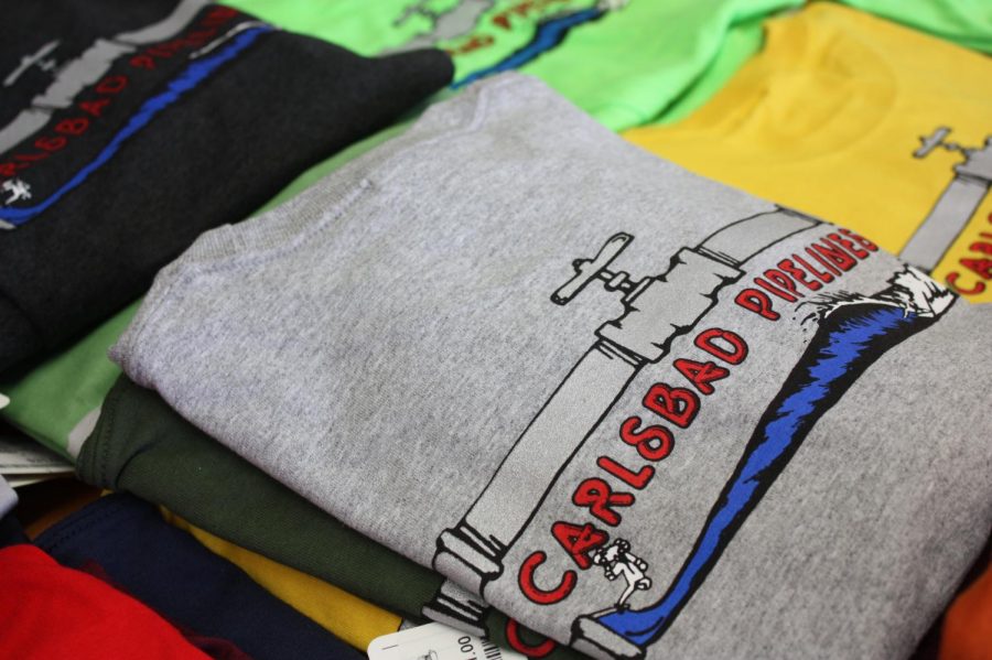 Carlsbad+Pipelines+t-shirts+are+for+sale+on+the+table+at+the+front+of+the+shop.+Pipelines+apparel+has+become+a+Carlsbad+classic.+