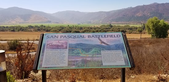 Here lies a sign explaining the history and purpose behind The Battle of San Pasqual which involved Mexicans and Americans. This battle lasted four days with many deaths causing the ghosts and spirits of the dead to still haunt the battlegrounds. 
