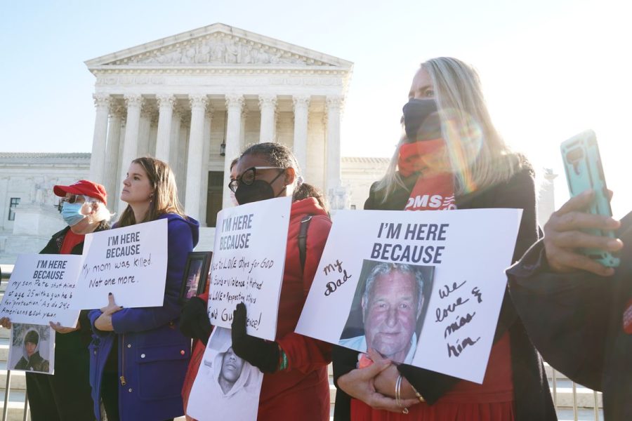 Gun violence survivors stand in front of the Supreme Court in Washington, DC. They gathered on the day of oral arguments in NYSRPA v. Bruen: Nov. 3