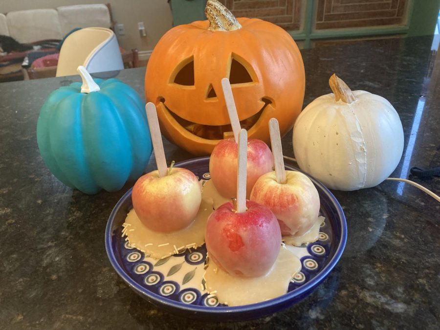 A batch of four caramel apples, surrounded by pumpkins to get in the mood for spooky season! Even if you’re like me and not a talented baker, these recipes still taste just as good as ever!