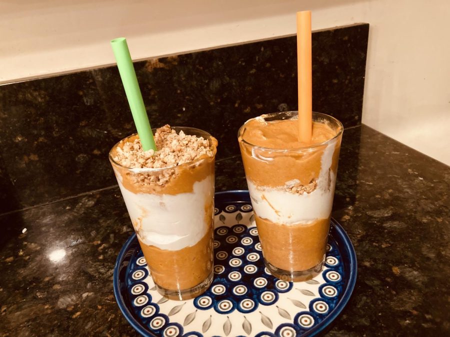 Two pumpkin-pie parfaits, consisting of a pumpkin smoothie, granola, and coconut whip. These are perfect for a quick autumn-themed snack, and are actually pretty healthy! (compared to other dessert recipes, of course)