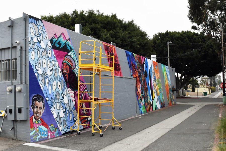 The+Art+Wall+brightens+up+Tyler+Street+Alley.+Six+artists+are+left+to+paint+the+wall%2C+including+Snyder+himself.+