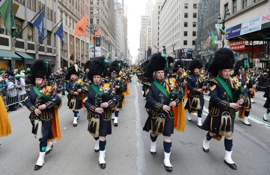 The New York City parade includes bagpipers who walk through the streets in front of two million people. The streets of Manhattan host an extravagant parade every year.
