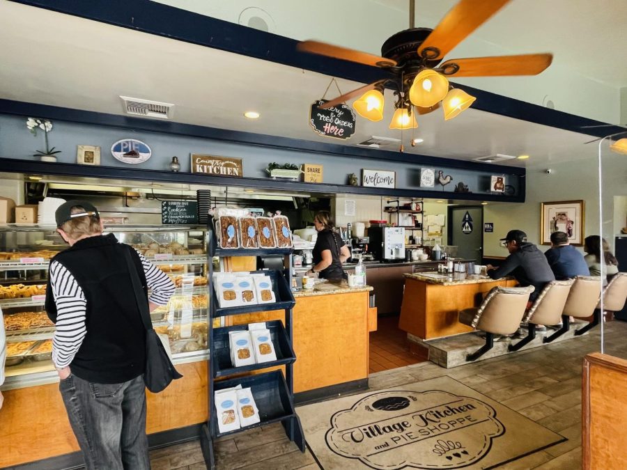  Customers sit at the restaurant’s mini bar as a waitress goes to grab their orders. The Village Kitchen and Pie Shoppe allows their guests to have quick and easy meals they can take on the go. 