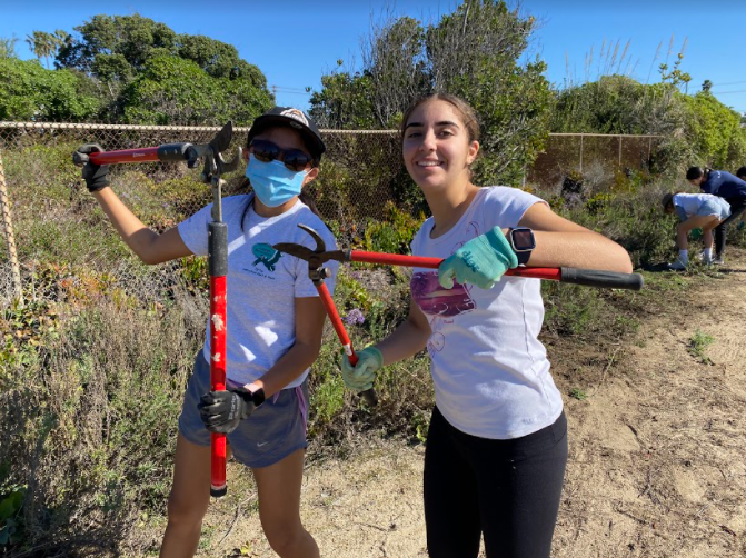  Freshmen Leila Young and Ariana Sharifi pose while helping out through Key Club. They volunteered at the trail event at the Agua Hedionda Lagoon.