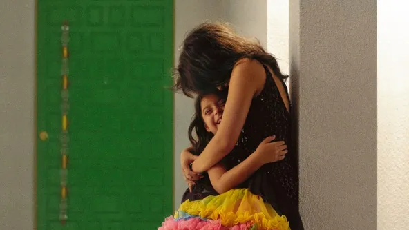 Singer and songwriter, Camila Cabello, poses for the camera by hugging a girl. Cabello released her third album this year called, “Familia.” 