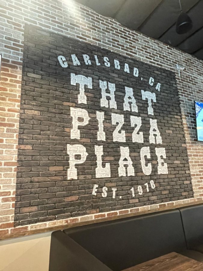 43-year-old brick wall from the original pizzeria accommodates for the also original black and white logo. A Carlsbad-family restaurant, the city’s name is displayed above the restaurant title. 