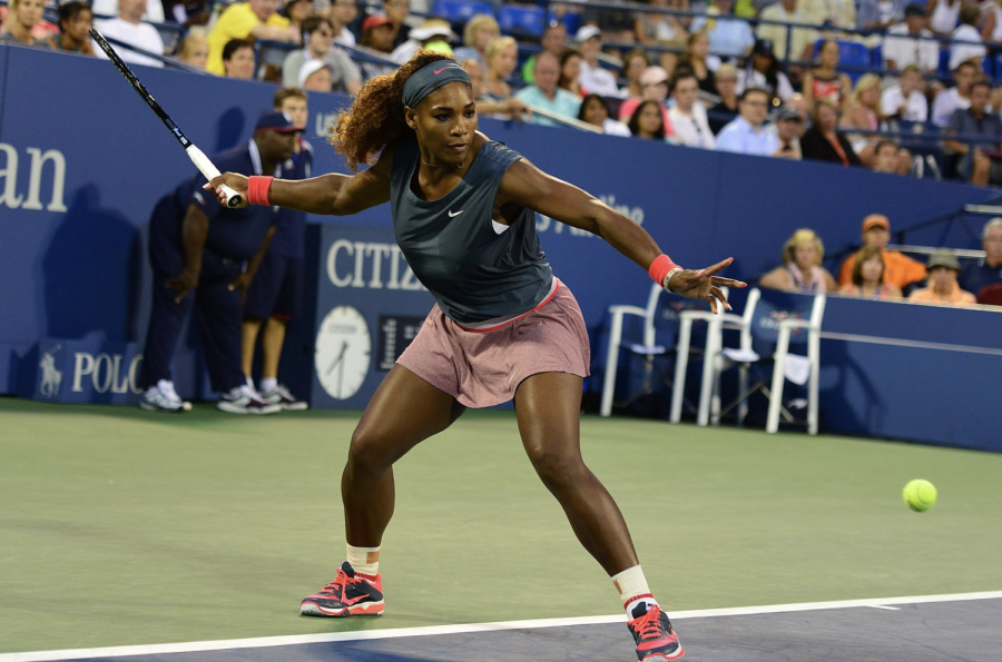 Serena Williams returns the ball during a match. WIlliams won her first U.S. Open at the age of 17.