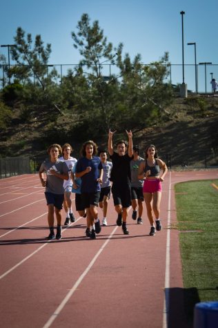 While running intervals around the track, runners are shown cheering and encouraging each other on. The community built around the team is essential for the team’s progression throughout the season. 