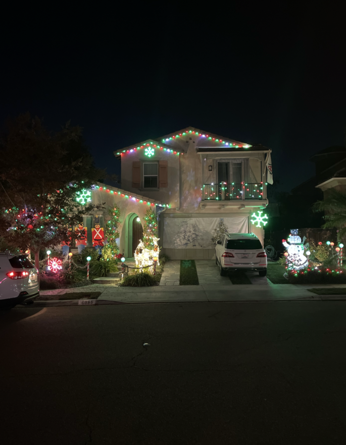 One of the many synchronized houses in the neighborhood is illuminated. This one was made up of more traditional decorations such as snowmen, reindeer and nutcrackers.