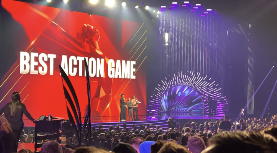 The+hosts+on+stage+at+the+Game+Awards+present+the+Best+Action+Game+award.+The+Game+Awards+first+began+in+2014+and+continues+to+have+events+on+a+yearly+basis.