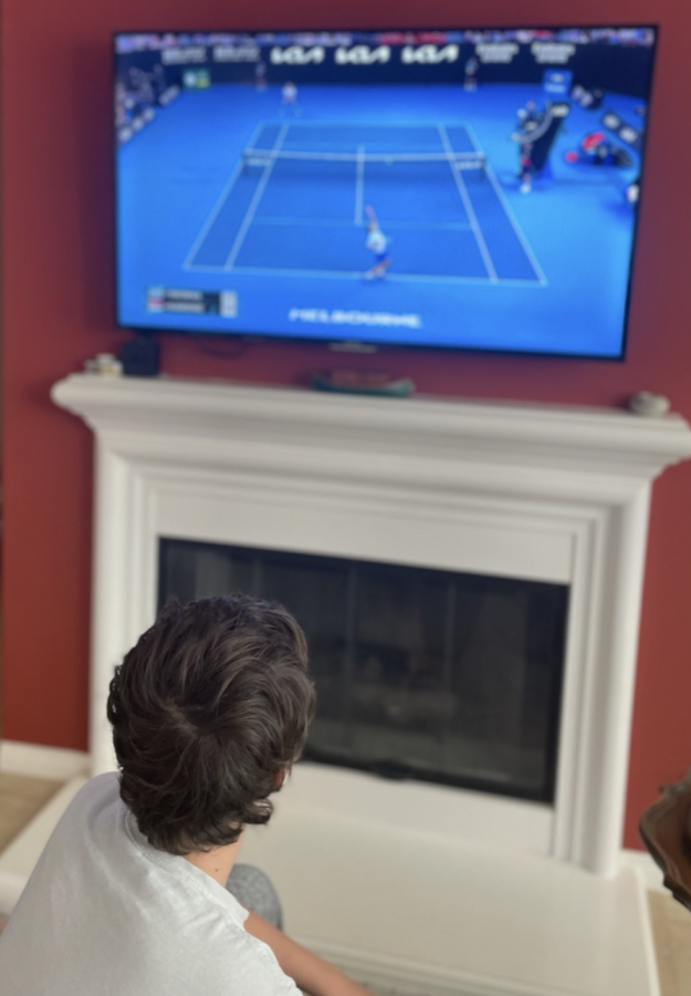  A Sage student immersively views the 2023 Australian Open Final. As stakes are high for the serb, this quite literally kept him on the edge of his seat.