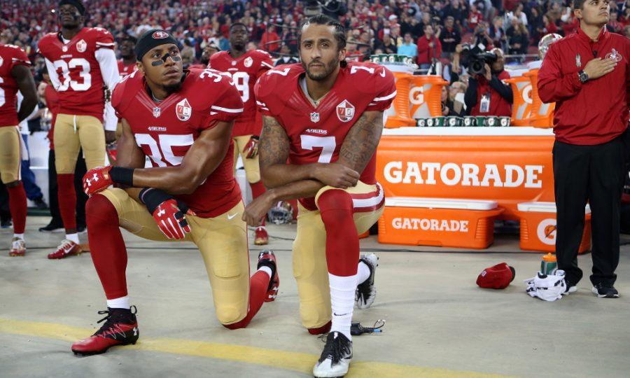 San Francisco 49ers Eric Reid (35) and Colin Kaepernick (7) take a knee during the National Anthem prior to their season opener against the Los Angeles Rams during an NFL football game Monday, Sept. 12, 2016, in Santa Clara, CA. The Niners won 28-0. (Daniel Gluskoter/AP Images for Panini) ORG XMIT: DGCA101